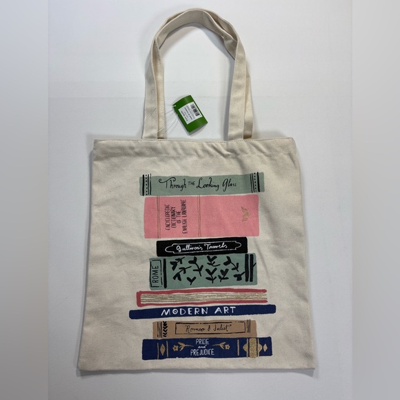 kate spade Handbags - kate spade Cream Canvas Tote with Pink, Navy and Green Book Stack Print